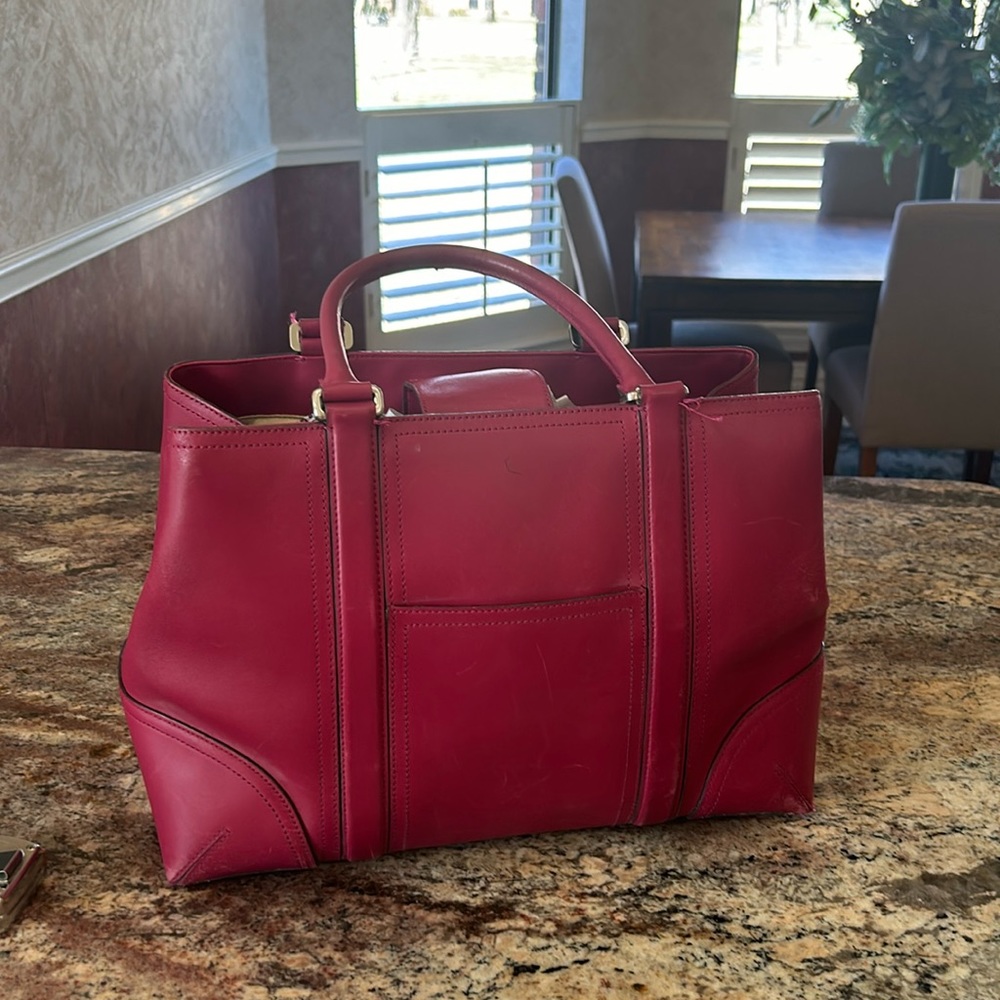 Ann Taylor pink leather bag. Hardly carried.Great shape. A roomy bag for travel.
